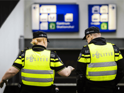 Dutch police officers patrol the Central Station in Amsterdam on March 22, 2016 as security measures were reinforced in the wake of blasts in Brussels. Belgium's neighbours France, Germany and the Netherlands tightened border security after the attacks on Brussels airport and metro system that left at least 26 dead.