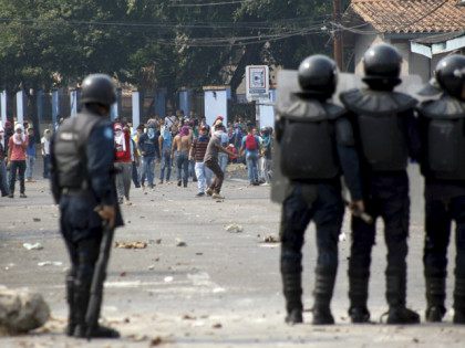 DDemonstrators and riot police clash during a protest against the increase in the price of