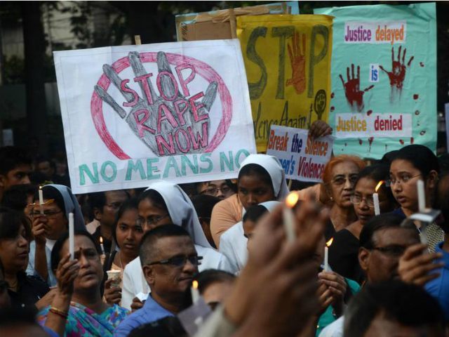 India, Kolkata : Indian Christians and other ndian residents protest against the gang rape of a nun at a Christian missionary school in eastern India as they gather for a silent solidarity rally in Kolkata, India, Monday, March 16, 2015. According to police 71 year old nun was gang-raped by …