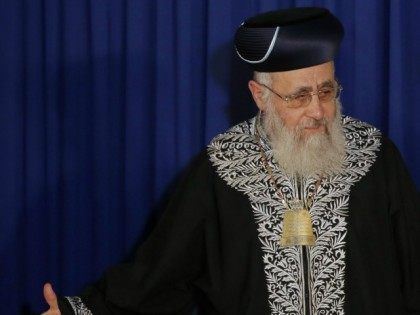 Pope Francis (R) walks with Israeli Sephardi Chief Rabbi, Yitzhak Yosef, during a visit to