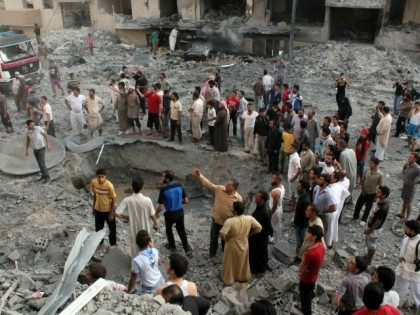 People gather around a crater at the scene of an explosion in the northern Syrian city of Raqqa, early on August 7, 2013. UN weapons inspectors tasked with looking into claims of chemical weapons use in Syria are 'completing their preparations' in The Hague before heading to Damascus, the United …