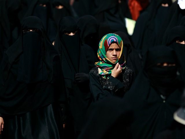 A Yemeni girl looks on during a protest by women in front of United Nations (UN) office in