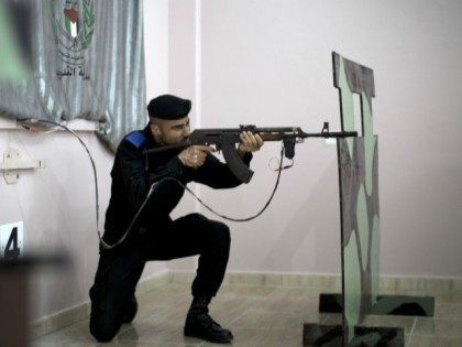 A member of the ruling Hamas security forces aims his rifle during a target shooting sessi