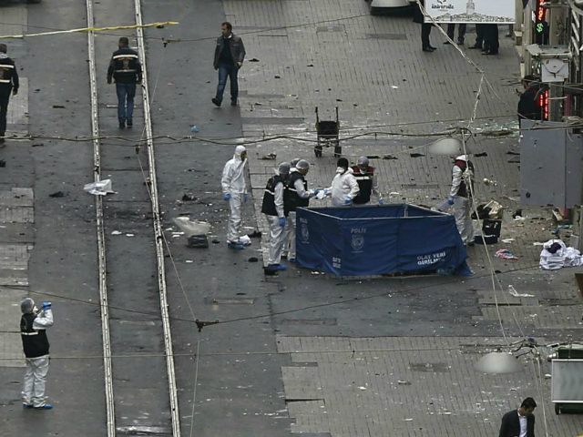 In this Saturday, March 19, 2016 photo, security and forensic officials work at the explos