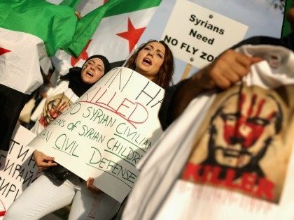 Americans and supporters of the Syrian people gathered to demonstrate against Russia's military build up and action in Syria and its four-year civil war.