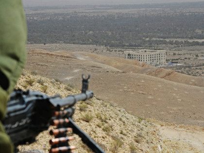 2813718 03/25/2016 A Syrian Arab Army soldier seen here on on a high ground overlooking Palmyra. Mikhail Voskresenskiy/Sputnik via AP