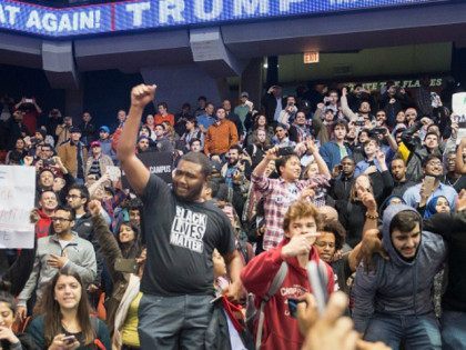 CHICAGO, IL - MARCH 11: Demonstrators celebrate after it was announced that a rally with R