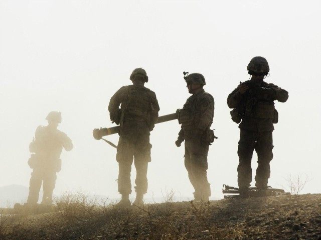 U.S. soldiers from D Troop of the 3rd Cavalry Regiment walk on a hill after finishing with a training exercise near forward operating base Gamberi in the Laghman province of Afghanistan December 30, 2014. REUTERS/Lucas Jackson