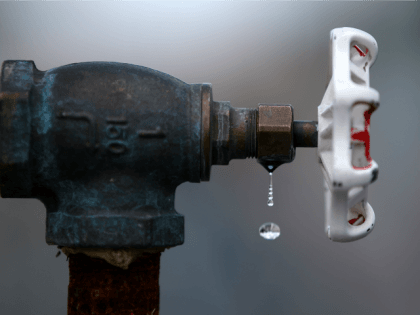 Water drips from a faucet at the Dublin San Ramon Services District (DSRSD) residential recycled water fill station on April 8, 2015 in Pleasanton, California.