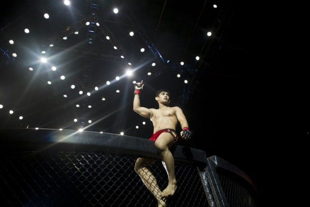 Aung La N Sang known as the "Burmese Python" from Myanmar celebrates after his fight with