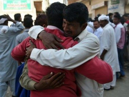 Pakistani Christians mourn the death of a relative killed in a suicide blast, at a graveya