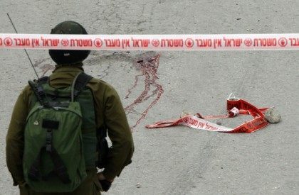 Blood stains from the body of a Palestinian assailant who was allegedly shot in the head b