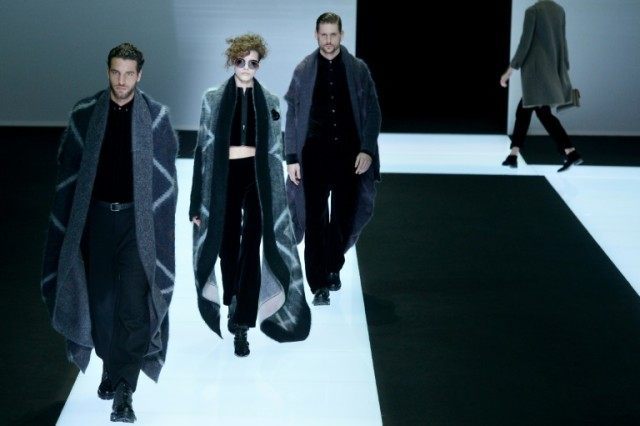 Models present creations for fashion house Giorgio Armani as part of the Women Autumn / Wi