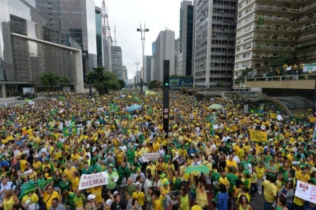 Demonstrators angered by a giant corruption scandal and the crumbling economy take part in