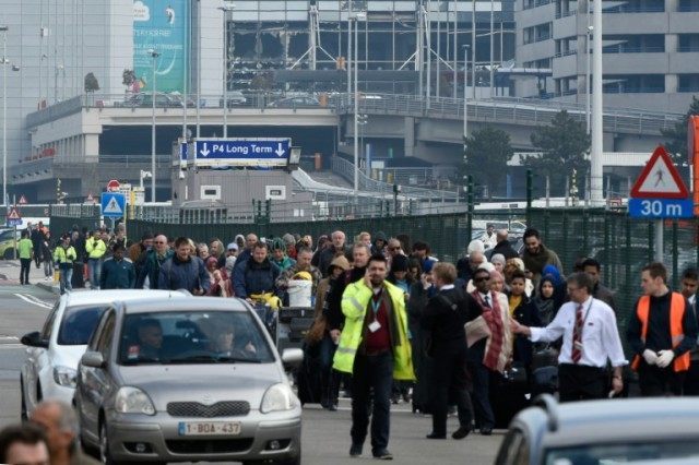 Passengers are evacuated from Brussels airport in Zaventem, on March 22, 2016, after twin
