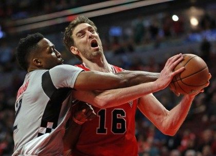 Houston Rockets' Dwight Howard (left) fouls Chicago Bulls' Pau Gasol during their game at