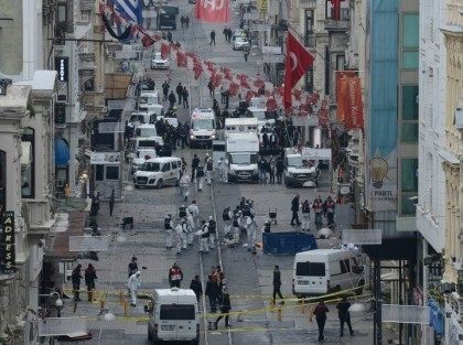 Turkish police, forensics and emergency services work at the scene of an explosion on Istiklal avenue in Istanbul on March 19, 2016