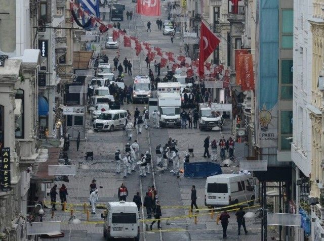 Turkish police, forensics and emergency services work at the scene of an explosion on Isti