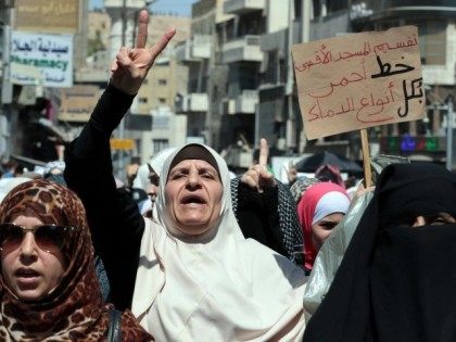 Jordanian women take part in a protest following the weekly Friday prayers in the Jordanian capital, Amman, on September 18, 2015, in solidarity with Palestinians who clashed with Israeli security forces for the past three days around Jerusalem's Al-Aqsa Mosque compound, Islam's third holiest site.