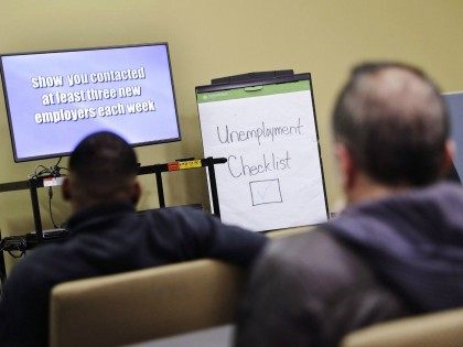 FILE - In this Thursday, March 3, 2016, file photo, people attend an employment orientation class at the Georgia Department of Labor office in Atlanta.