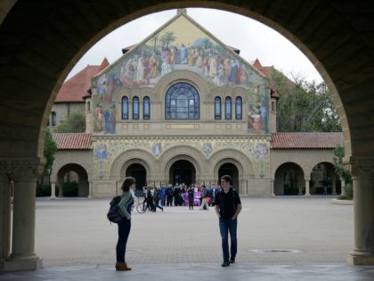 Students walk on campus at Stanford University Wednesday, Jan. 13, 2016, in Stanford, Calif.