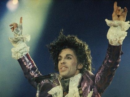 Rock singer Prince performs at the Forum in Inglewood, Calif., during his opening show, Feb. 18, 1985. (AP Photo/Liu Heung Shing)