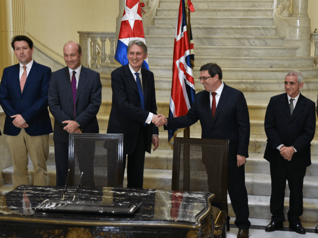 British Foreign Secretary Philip Hammond shakes hands with his Cuban counterpart Bruno Rodriguez at