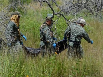 BORSTAR Border Patrol Agents remove body of deceased illegal alien in Brooks County. (Phot