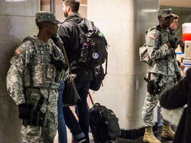 Members of the National Guard watch over Thanksgiving travelers at Penn Station on Novembe