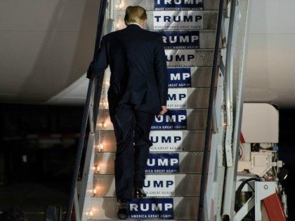 Donald Trump boards his plane following a rally on March 14, 2016 in Vienna Center, Ohio.