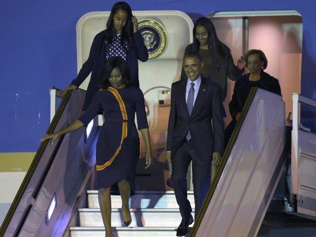 Barack Obama and First Lady Michelle Obama arrive with their daughters Sasha and Malia on