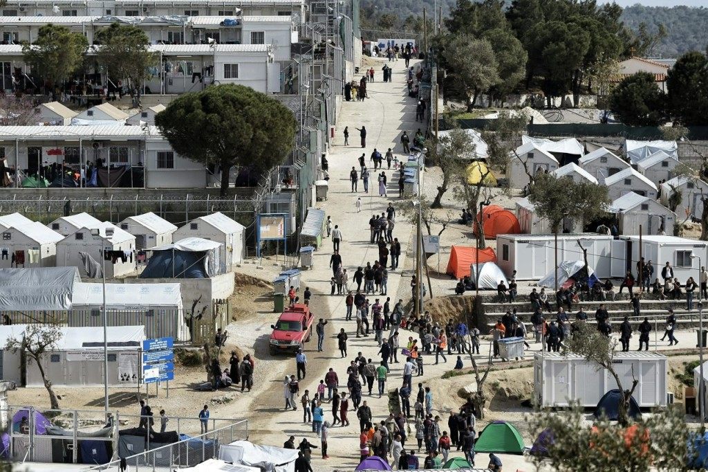 A picture taken in Mytilene, on Lesbos island on April 3, 2016 shows the Moria migrant camp transformed in police-run detention facility. Migrants returns from Greece to Turkey will begin on April 4, 2016 under the terms of an EU deal that has worried aid groups, as Athens struggles to manage the overload of desperate people on its soil. Over 51,000 refugees and migrants seeking to reach northern Europe are stuck in Greece, after Balkan states sealed their borders. Hundreds more continue to land on the Greek islands every day despite the EU deal. / AFP / ARIS MESSINIS (Photo credit should read ARIS MESSINIS/AFP/Getty Images)