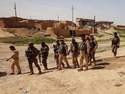 Iraqi soldiers secure an area near the frontline on April 9, 2016 in the town of Kharbardan, located 10 kilometres (6 miles) south of Qayyarah, during military operations to recapture the northern Nineveh province from the Islamic State group's jihadists. Iraqi army troops and allied paramilitary fighters on March 24 …