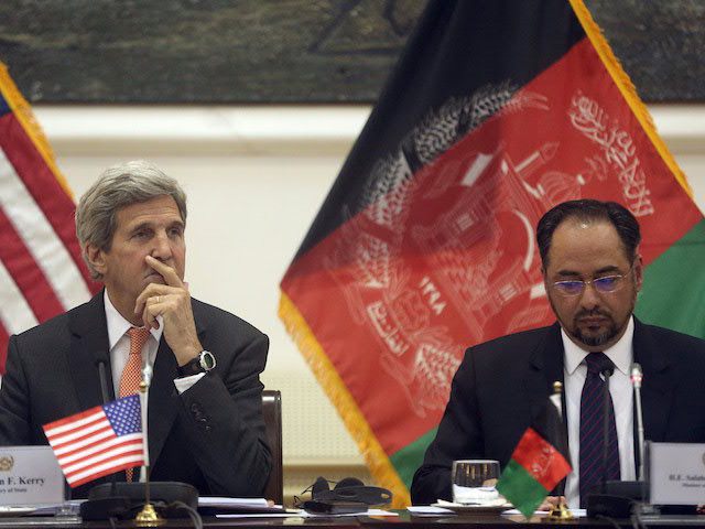 U.S. Secretary of State John Kerry (L) listens on as Afghan Foreign Minister, Salahuddin Rabbani, speaks during a conference, in Kabul, on April 9, 2016. / AFP / POOL / MASSOUD HOSSAINI (Photo credit should read MASSOUD HOSSAINI/AFP/Getty Images)