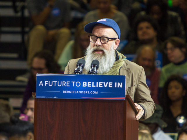 POUGHKEEPSIE, NEW YORK - APRIL 12: Michael Stipe speaks at Senator Bernie Sanders rally at