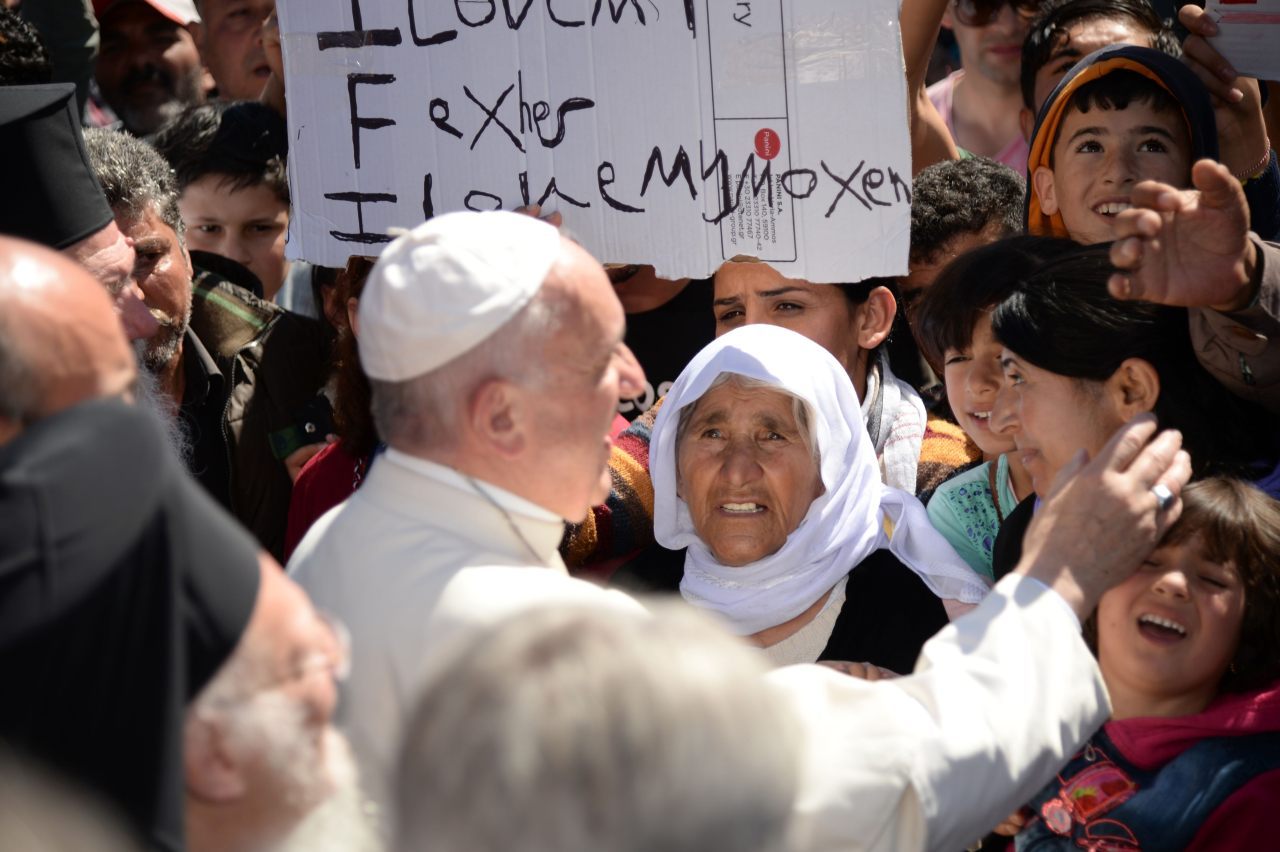 Pope Francis greets migrants and refugees at the Moria refugee camp (FILIPPO MONTEFORTE/AFP/Getty Images)