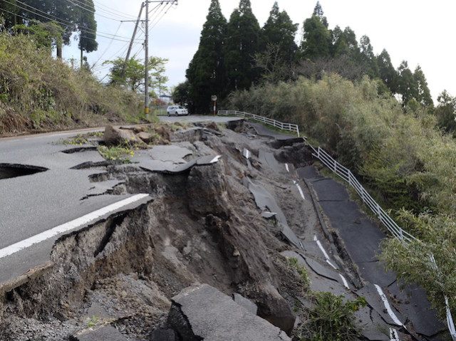 The picture shows a road damaged by earthquakes in Minami-Aso, Kumamoto prefecture, on Apr