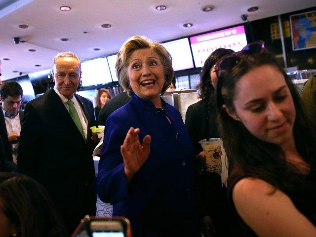 : Democratic presidential candidate, former U.S. Secretary of State Hillary Clinton greets patrons at Queens Crossing mall on April 17, 2016 in the Queens borough of New York City. The Democratic and Republican primaries in New York are tomorrow. (Photo by