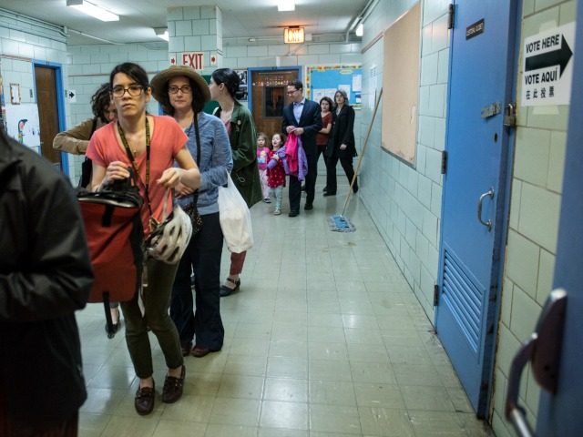People line up to check into their voting station at Public School 321 on April 19, 2016 in the Brooklyn borough of New York City.