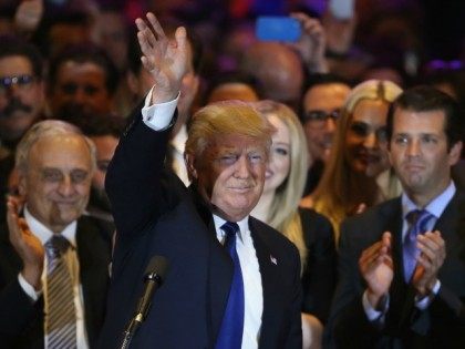 Republican Presidential candidate Donald Trump waves to the crowd after winning the New Yo