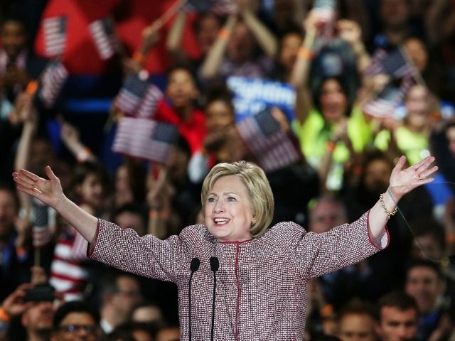 Democratic presidential candidate Hillary Clinton walks on stage after winning the highly
