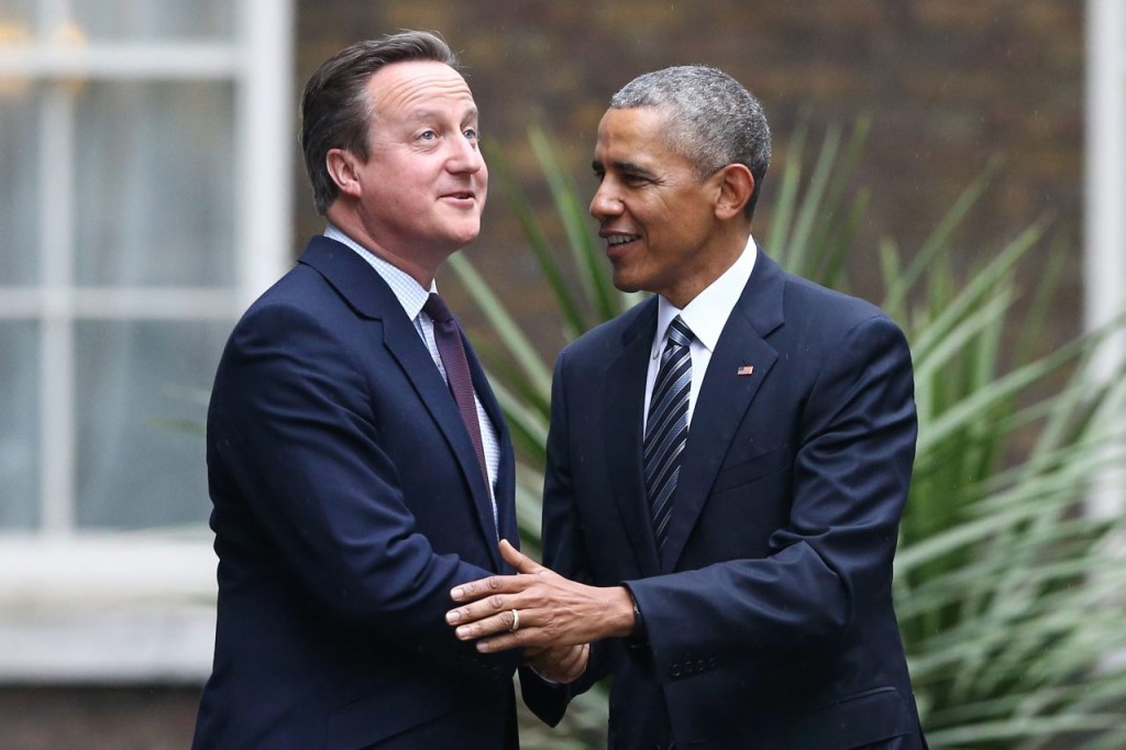 Britain's Prime Minister David Cameron (L) greets US President Barack Obama (R) as Obama arrives for talks at Downing Street in central London on April, 22, 2016.