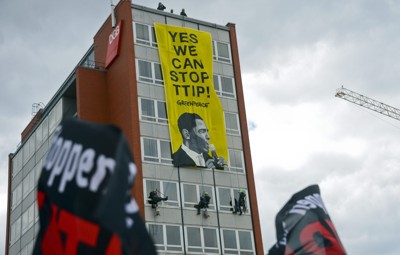 HANOVER, GERMANY - APRIL 23: Protesters rallying against the TTIP and CETA free trade agreements march on the eve of a visit by U.S. President Barack Obama on April 23, 2016 in Hanover, Germany. Many in Germany are wary of the agreements and claim that both TTIP, a free trade agreement being negotiated between the European Union and the United States, and CETA, a similar agreement between the E.U. and Canada, will have far-reaching negative impacts in Europe that include labor, economic, environmental and legal aspects. (Photo by Sascha Schuermann/Getty Images)