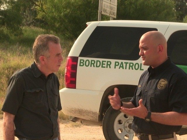 Glen Robertson with Border Patrol Agent Hector Garza on Border