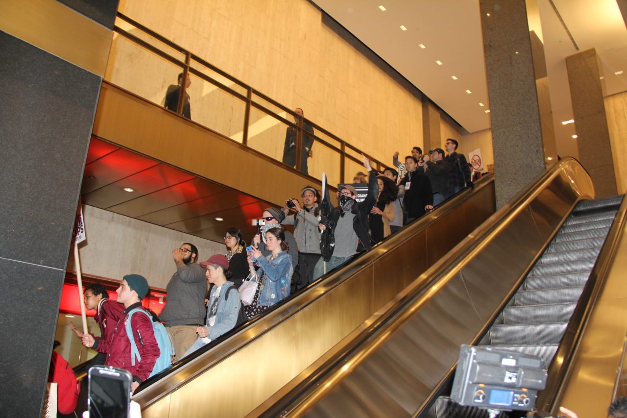 After being repelled the agitators are forced to retreat down the escalator