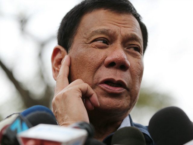 Philippine presidential candidate Rodrigo Duterte gestures as he answers questions from reporters at the University of the Philippines in suburban Quezon city, north of Manila, Philippines, Thursday, Feb. 18, 2016. Five candidates are running for President in the coming elections this May. (AP Photo/Aaron Favila)