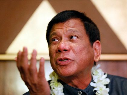 FILE - In this March 10, 2016 file photo, Davao City Mayor Rodrigo Duterte talks to the me