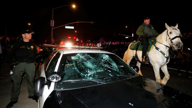 Police Car and horse anti-Trump protest CBS News