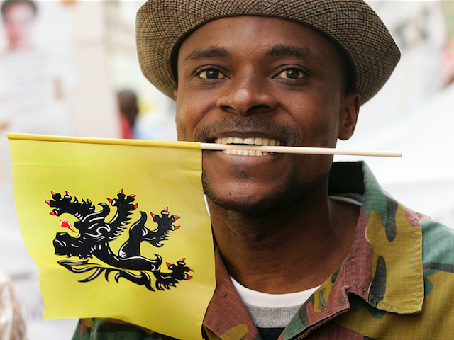 Congolese demontraters carrying the Flemish flag