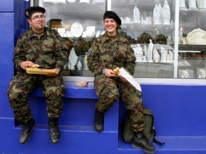 Swiss soldiers eat during the international military pilgrimage Getty